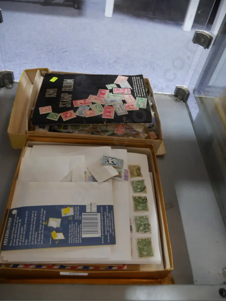 2 boxes assorted stamps, stamp album Image 1++