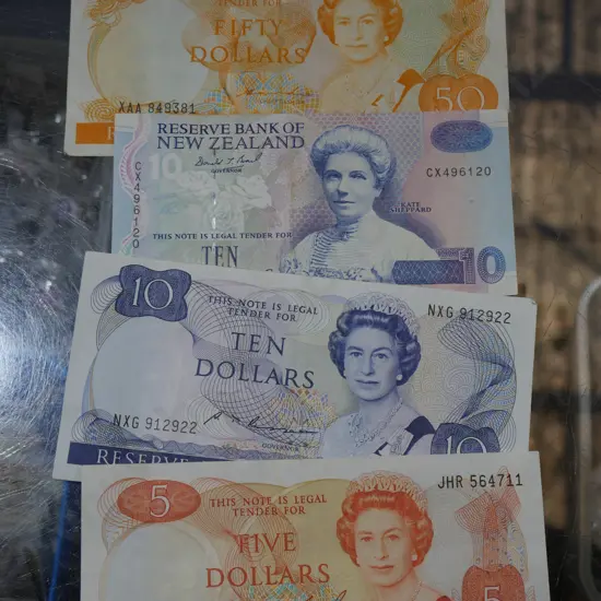 NZ bank notes - $50, 2x $10, and $5
