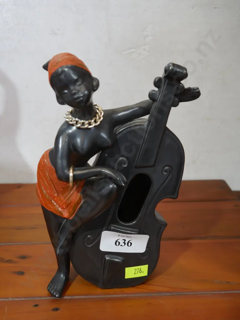Lady figurine playing instrument Image 1++