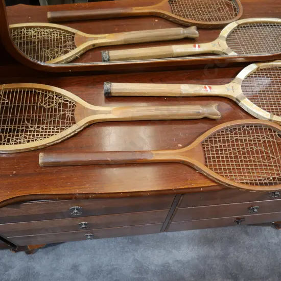 Three wooden rackets