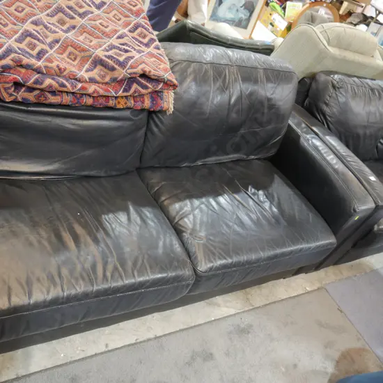 Two-piece black leather settees