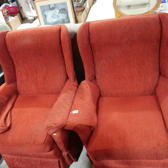 Pair of red wingback armchairs