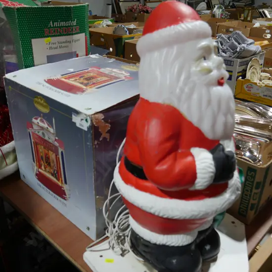 Santa figurine and boxed Nutcracker suite