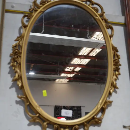 Gilt frame oval mirror