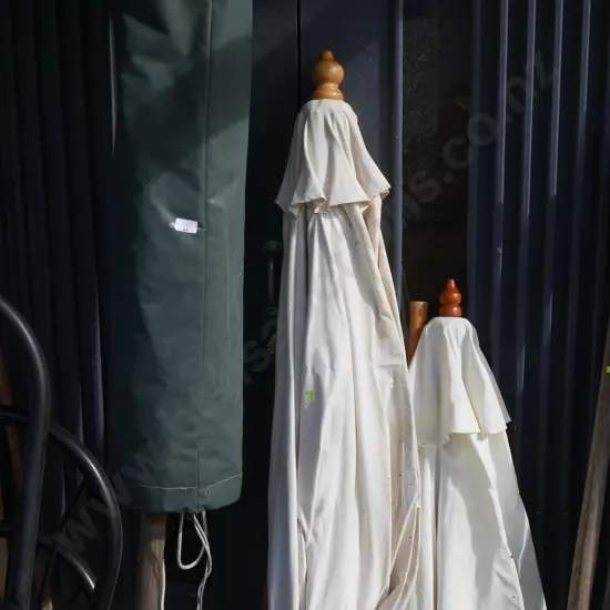 Three large outdoor sun umbrellas