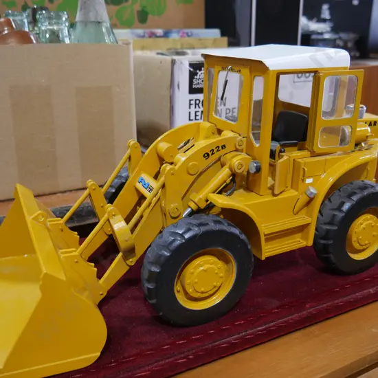 Cased model caterpillar loader