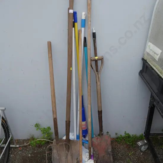 Assorted garden tools and mops