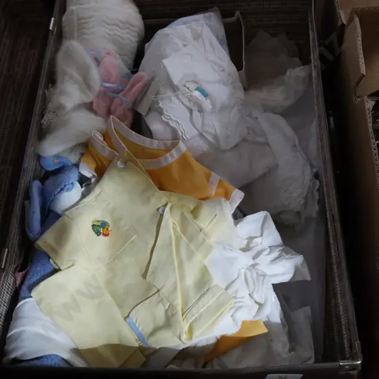 Suitcase and baby clothes