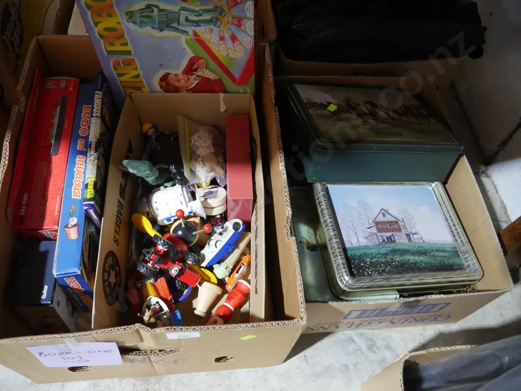 Two boxes of tins and toys etc Image 1++