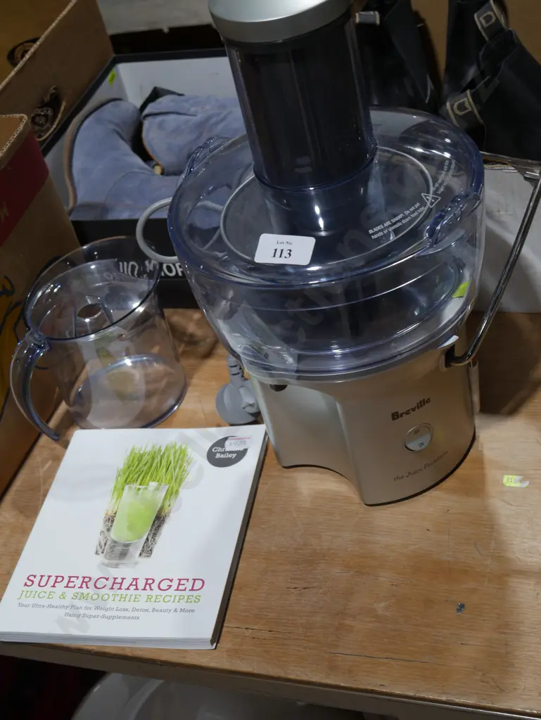 Breville  juicer and book Image 1++