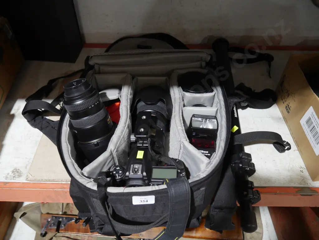 Nikon camera and accessories in bag Image 1++