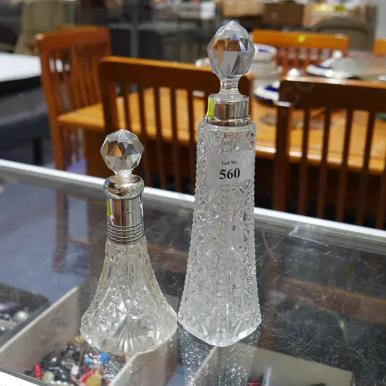 2 sterling silver topped perfume bottles