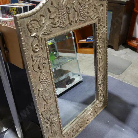 Ornate bevilled mirror
