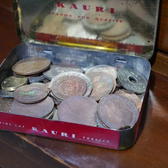 Tin of old coins