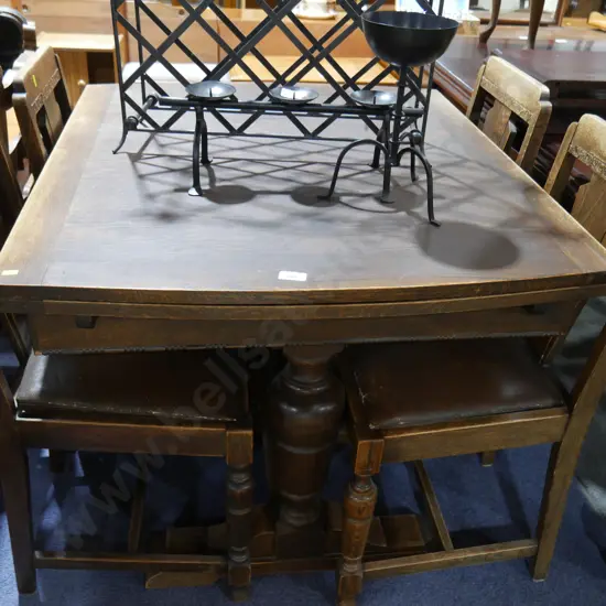Oak draw leaf table and four chairs