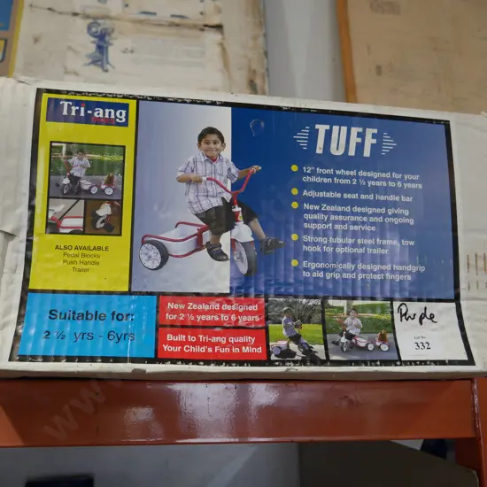 Boxed  purple tri ang trike