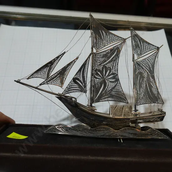 Silver sailing ship on stand