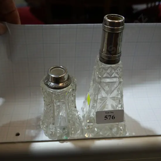 2 sterling silver topped bottles