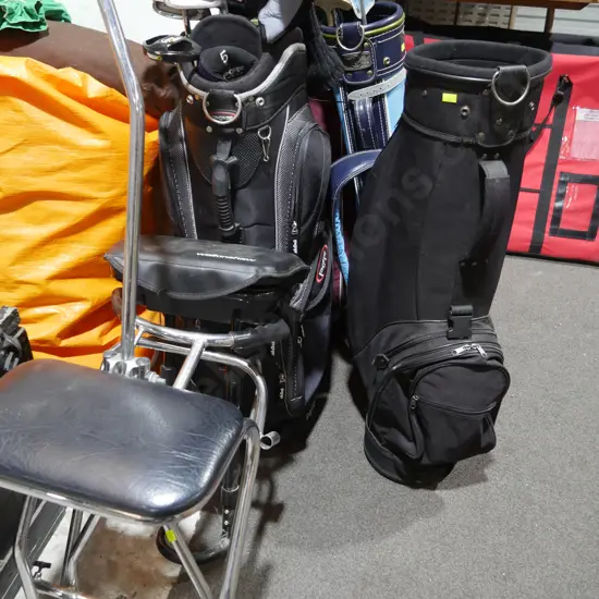 4 golf bags, trolley and golf clubs