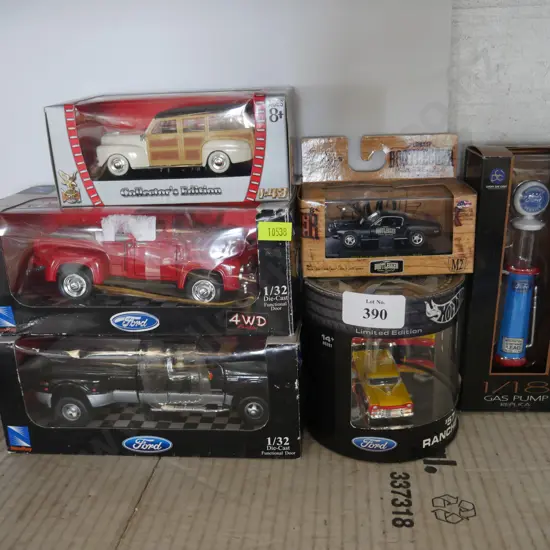 5 model cars and gas pump replica