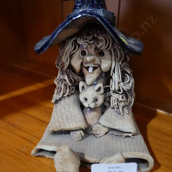 Witch and cat figurine