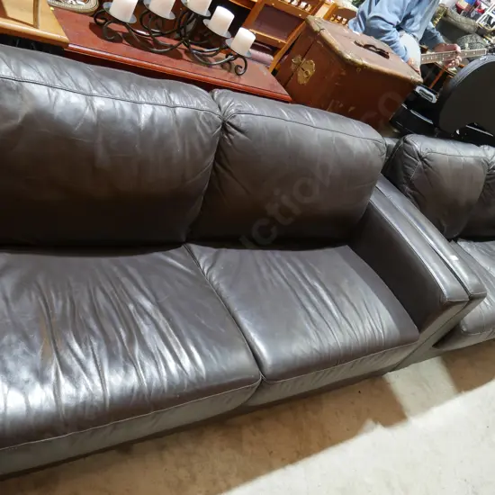 Two-piece brown leather lounge suite