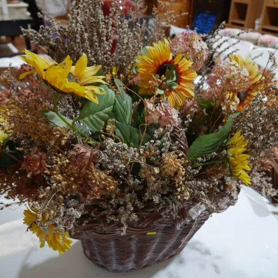 Cane basket and artificial flowers