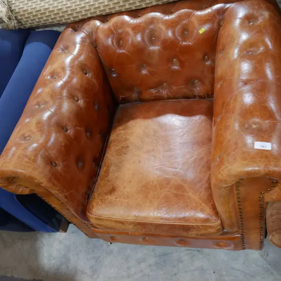 Deep button leather tub chair