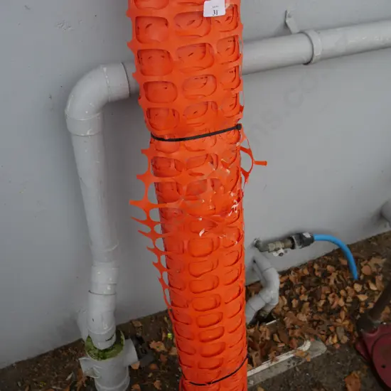 Roll of orange barrier fencing
