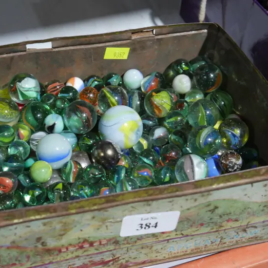 Tin of marbles