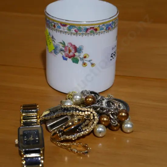 Cup with costume jewellery