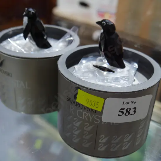 2 Cased Swarovski crystal penguins (1 A/F)