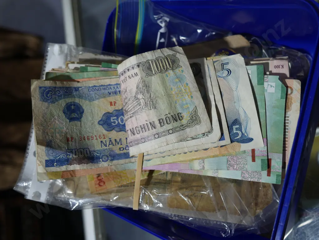 Plastic tub of badges, bank notes, button etc Image 1++