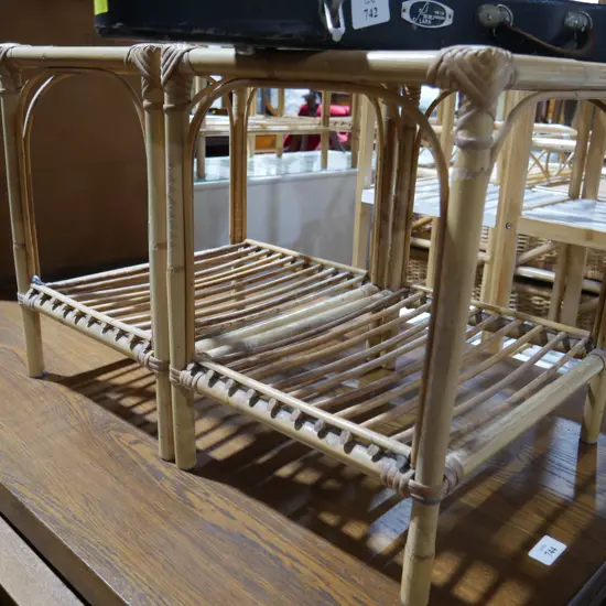 2 glass top cane side tables