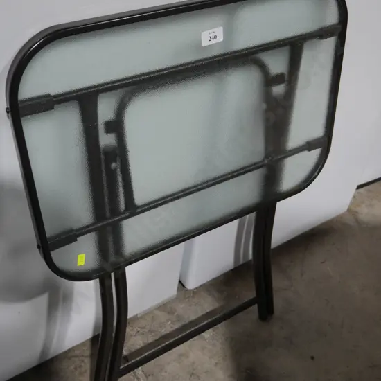 Folding glass top table