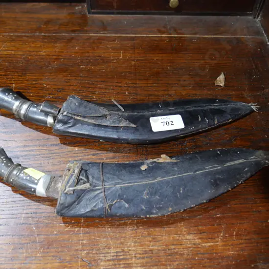 2 kukri knives in leather sheaths