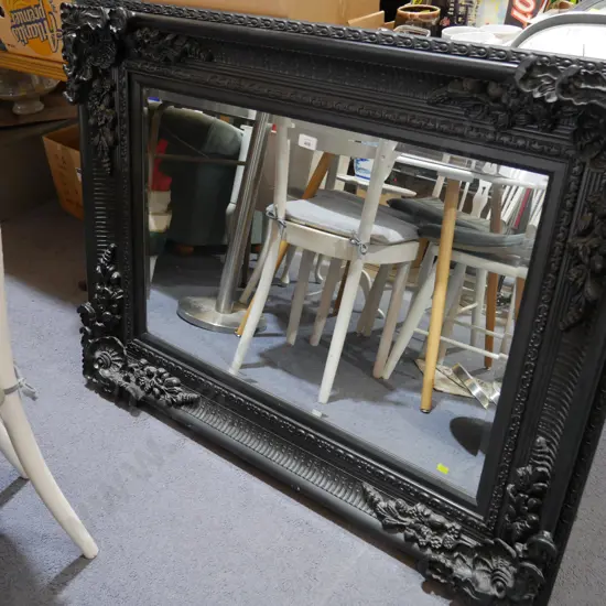 Large black framed mirror