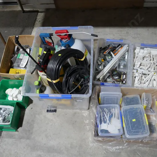 7 boxes/containers of brackets, garden sprayers etc