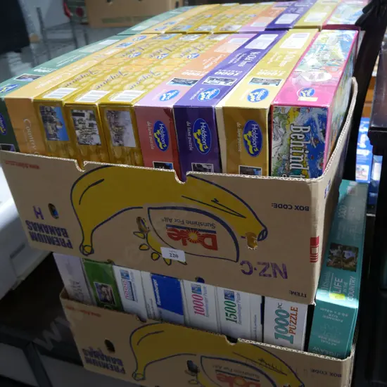 Two boxes of jigsaw puzzles