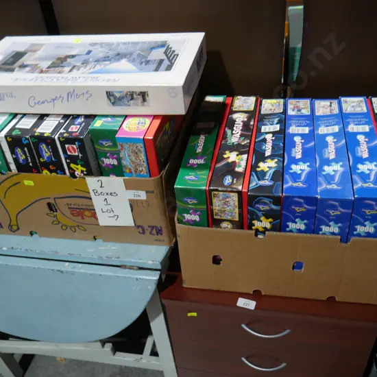 Two boxes of jigsaw puzzles