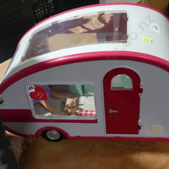 Toy caravan and doll