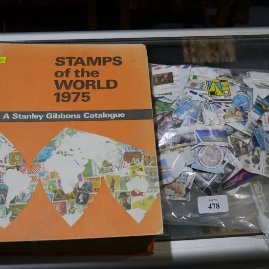 Stamp catalogue and loose stamps