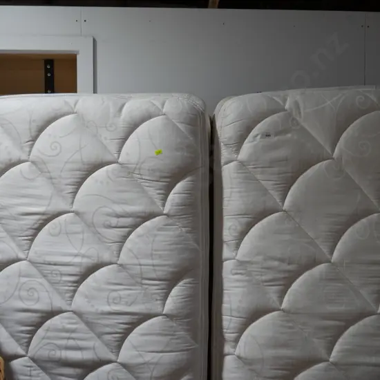 Two single beds with head boards