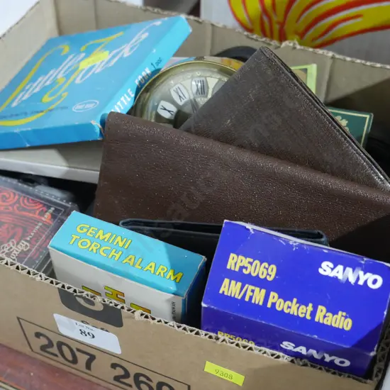 Sanyo pocket radio, brass alarm clock, other sundries