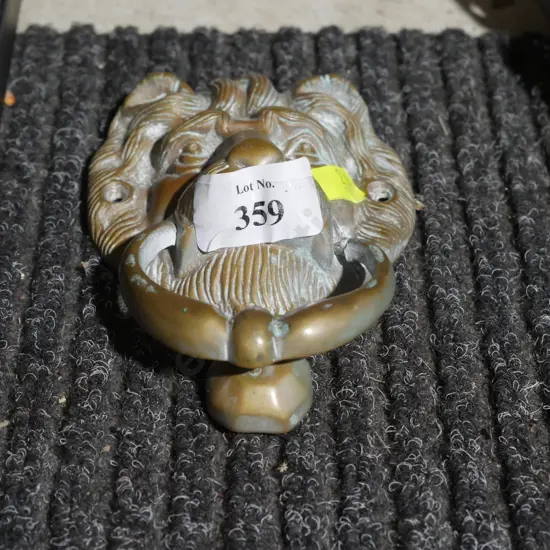 Brass lion head door knocker