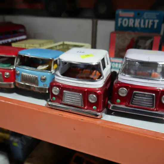 4 tin trucks