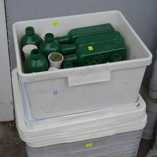 Plastic containers and green glass bottles