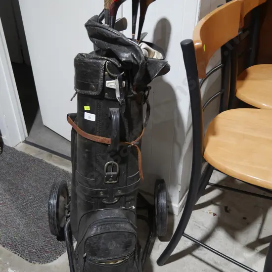 Golf clubs, bag and trundler