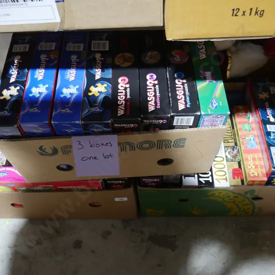Three boxes of jigsaw puzzles