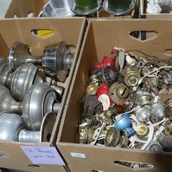 Two boxes of kerosene lamp parts
